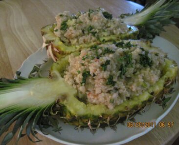 Pineapple fried rice served in a fresh pineapple